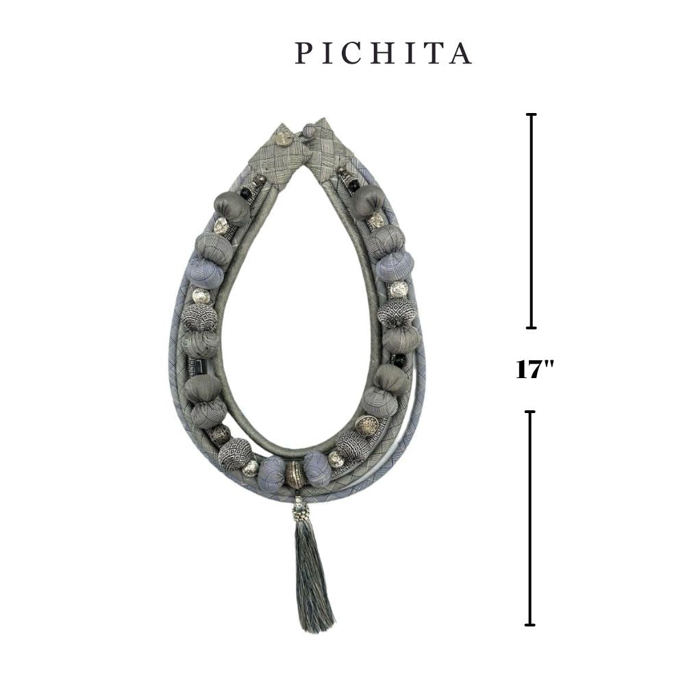 Bohemian-style light gray fabric bead necklace.