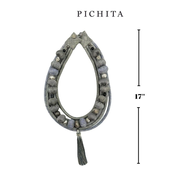 Bohemian-style light gray fabric bead necklace.