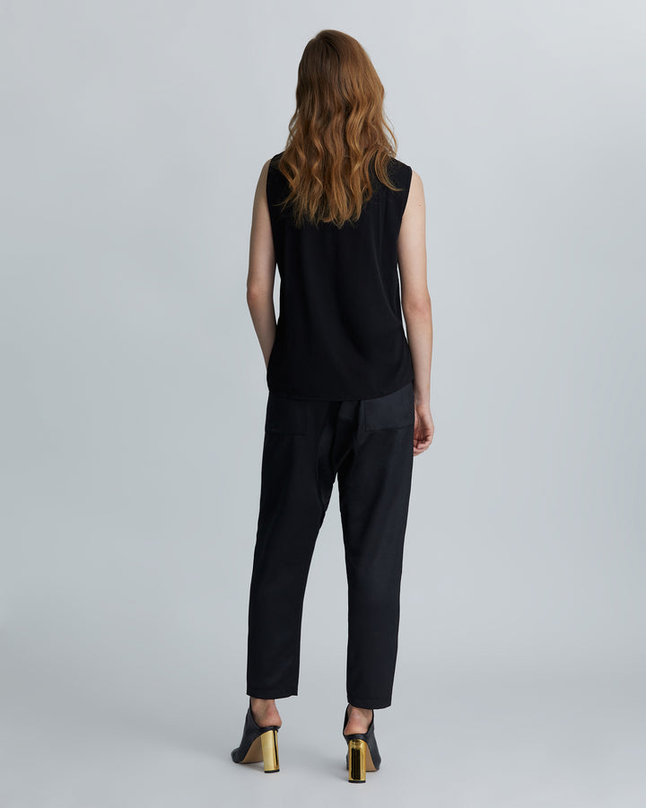 woman wearing the Black high-rise tapered leather embossed lounge pants back