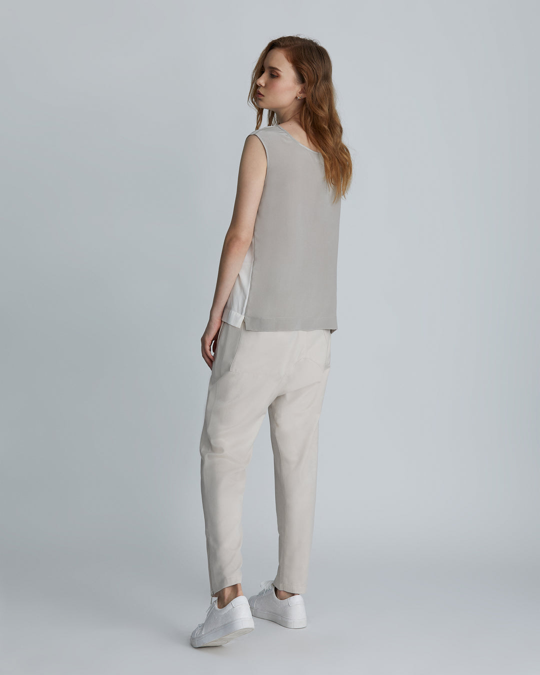 Woman modeling the High-rise Ivory tapered ankle women's lounge pants