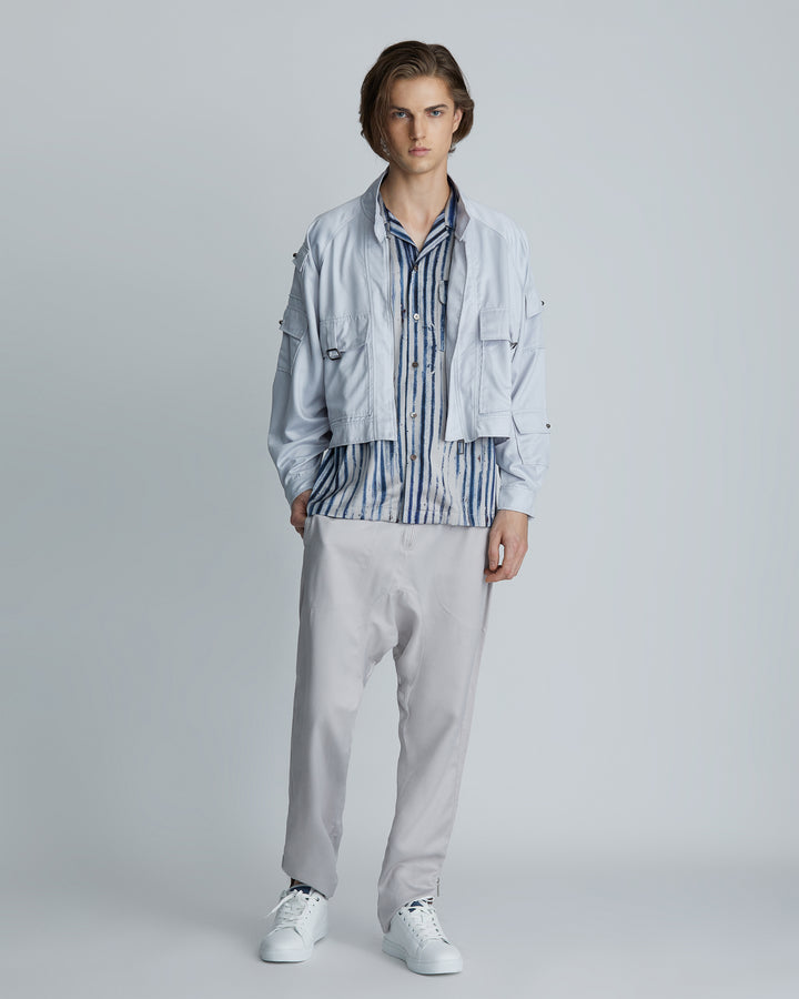 Man wearing the High-Rise Light Grey Tapered Ankle Lounge Pants